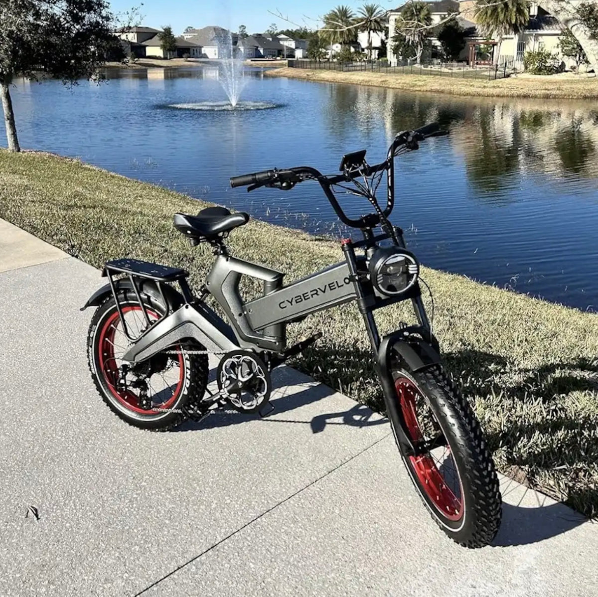 Rider climbing a steep hill on a fat-tire folding e‑bike